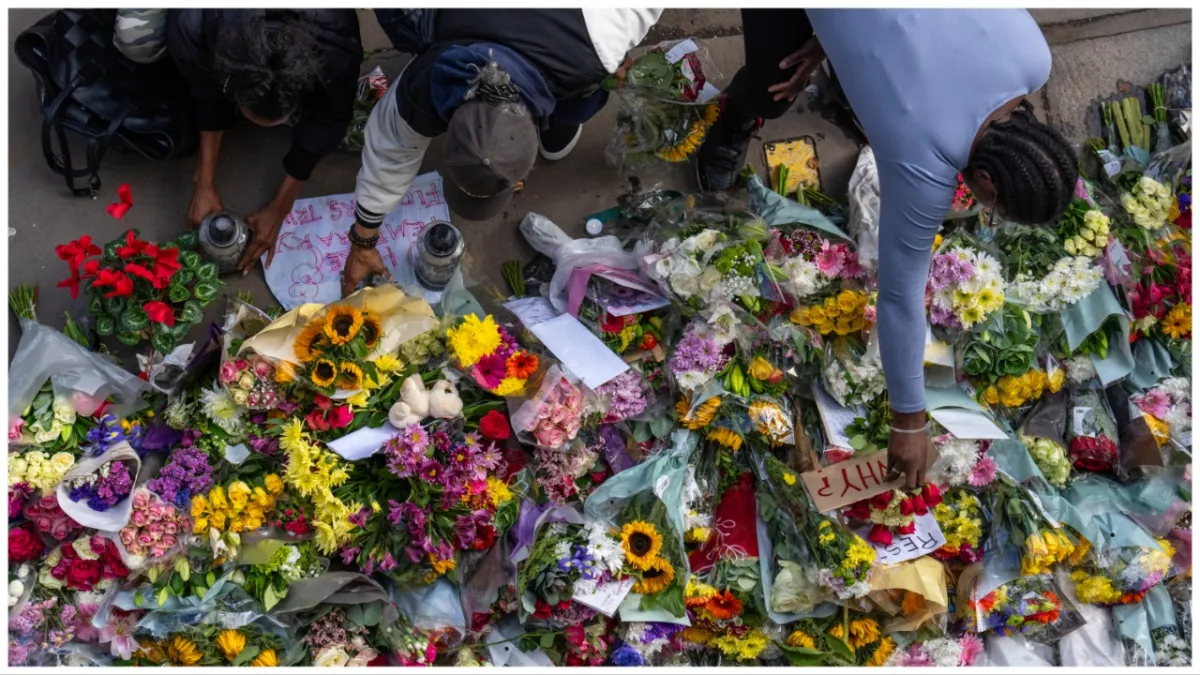 CROYDON, ENGLAND - SEPTEMBER 29: People lay flowers and tributes at the scene of Elianne Andam's murder, on September 29, 2023 in Croydon, England. 15-year-old Elianne Andam was stabbed to death on the morning of the 27th in Croydon, south London, on her way to Old Palace of John Whitgift girls' school. She died at the scene at 09:21. An arrest was made at 09:45 and he was known to the victim. (Photo by Carl Court/Getty Images)