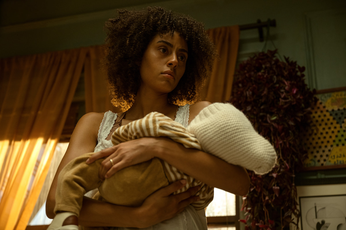 Emma holds baby Brian, looking tired and suspicious, in The Changeling.