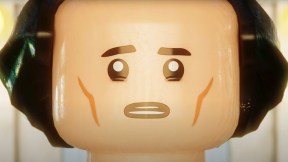 Close up of Loki's face in LEGO form. LEGO Loki looks at a bright light in front of him, worried.
