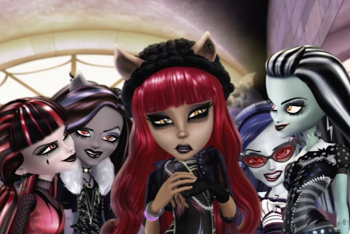  Monster High 13 Wishes; Howleen Wolfe, a red haired werewolf, stands surrounded by the ghouls, all wearing sinister expressions.