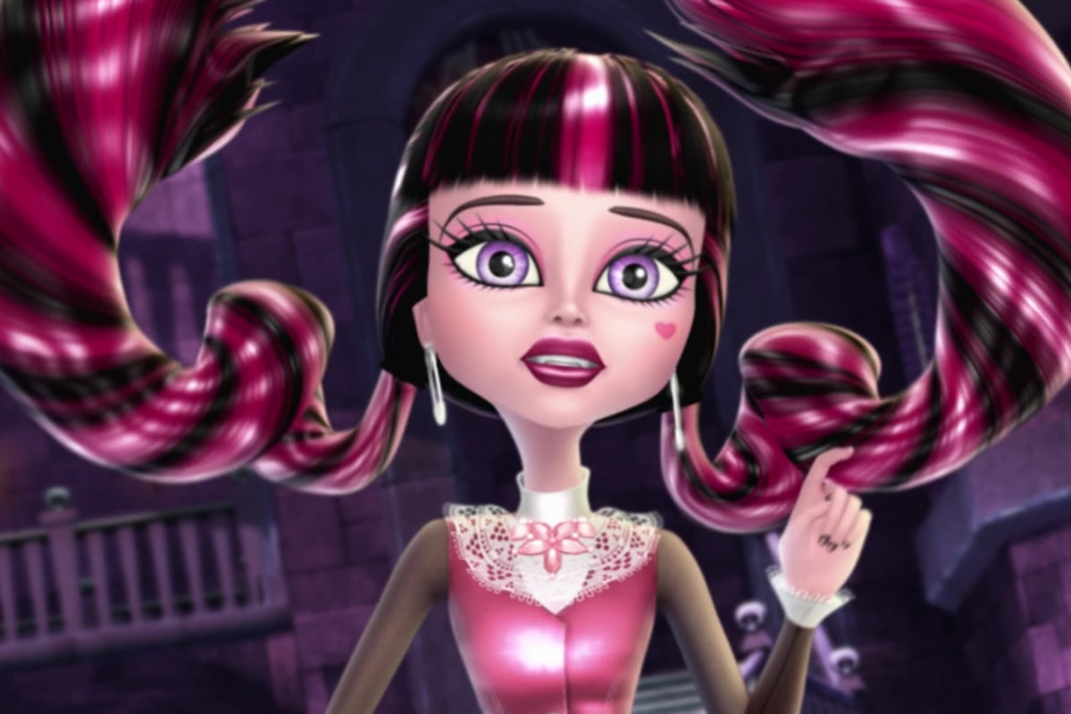  Monster High: Haunted; Close up of Draculaura looking surprised as her long pink and black pigtails float up.