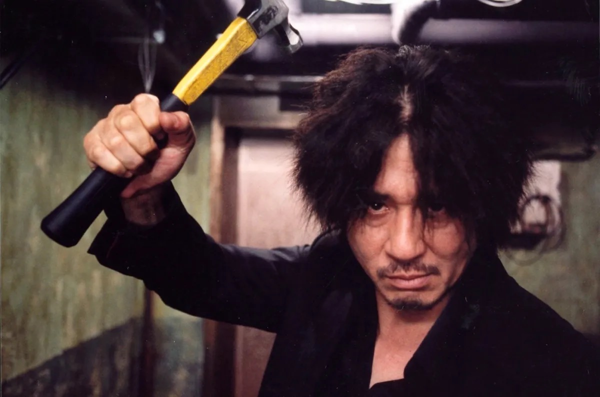A man brandishes a hammer menacingly in "Oldboy"