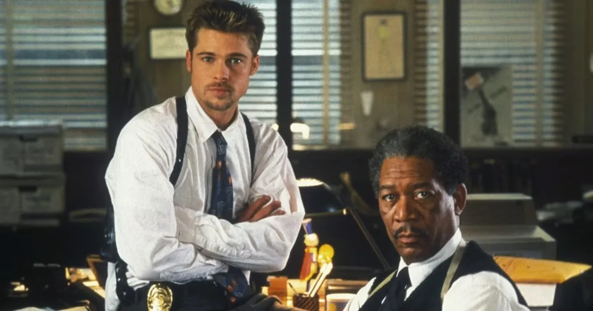 Brad Pitt and Morgan Freeman sitting in the police station in "Se7en"