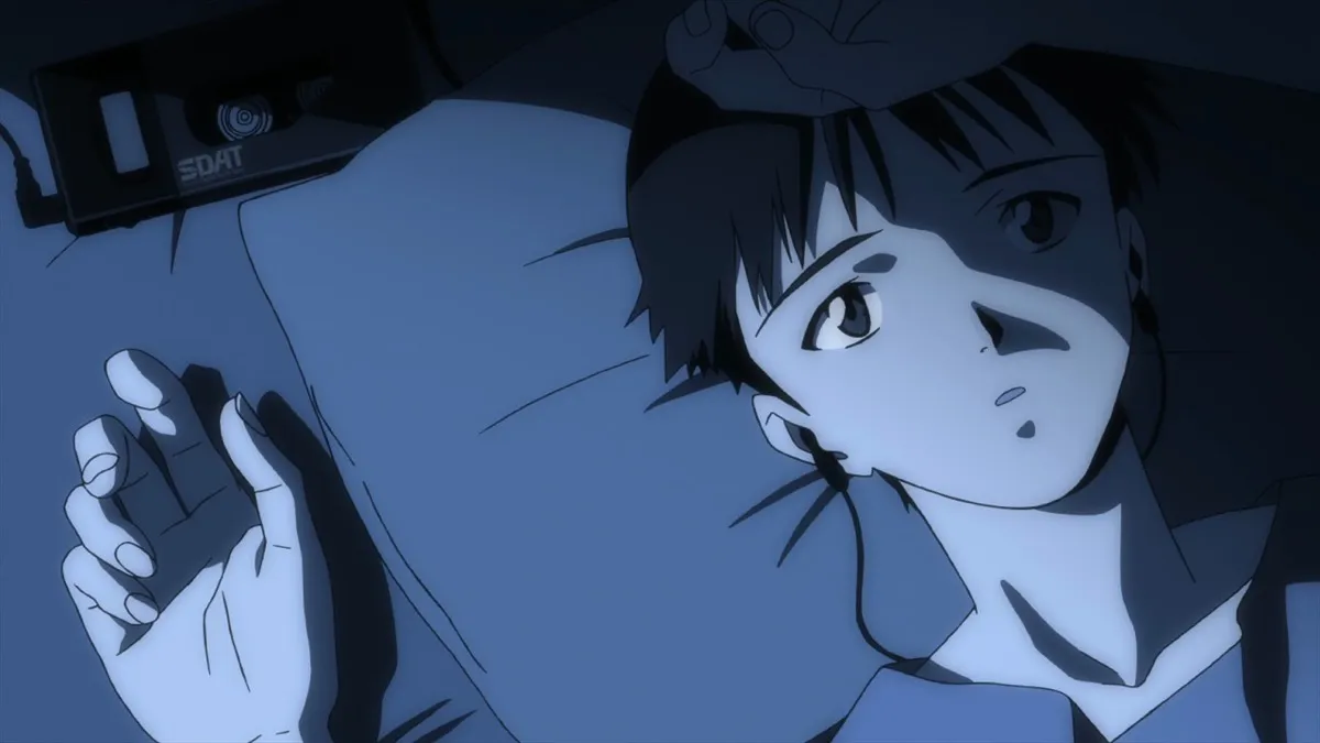 Shinji lays in bed listening to music in "Neon Genesis Evangelion" 