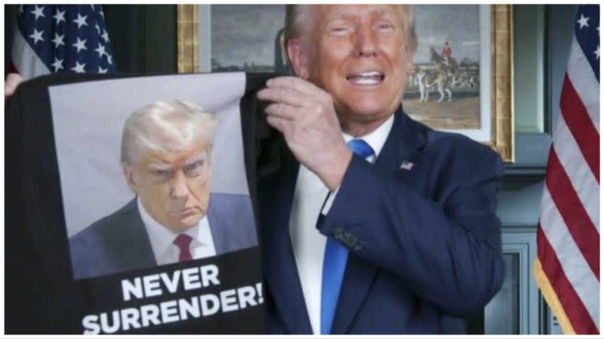 Donald Trump hawks t-shirt of mugshot with the caption "Never Surrender" despite the photo being literally of him surrendering to authorities.