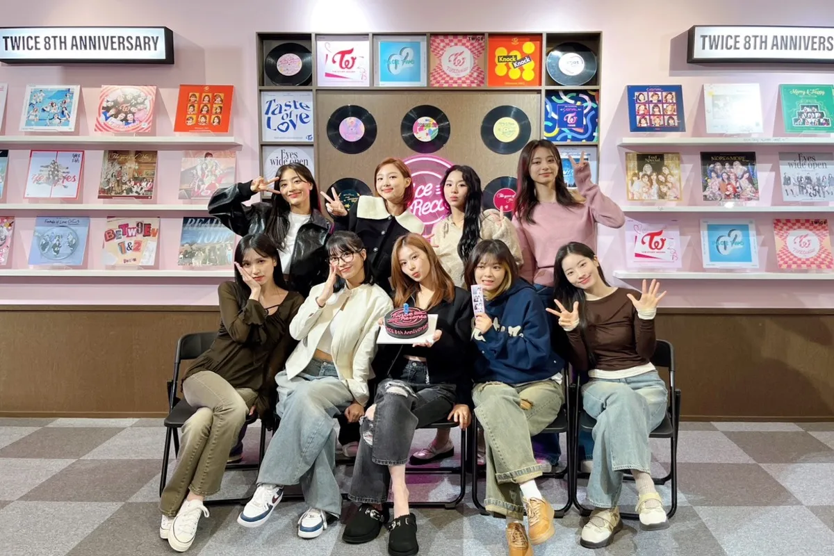 Momo, Sana, Jihyo, Tzuyu, Nayeon, Chaeyoung, Mina, Jeongyeon, and Dahyun from TWICE during their 8th Anniversary shoot