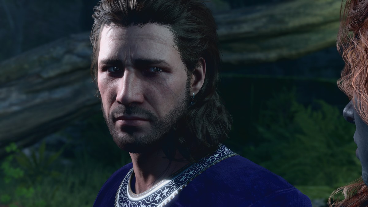 A screenshot of Gale of Waterdeep from Baldur's Gate 3 frowning and looking off to the right side.