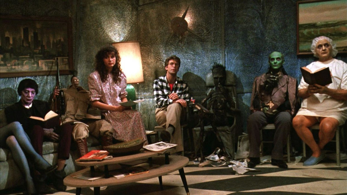 Adam (Alec Baldwin) and Barbara (Geena Davis) in the afterlife waiting room in 'Beetlejuice'
