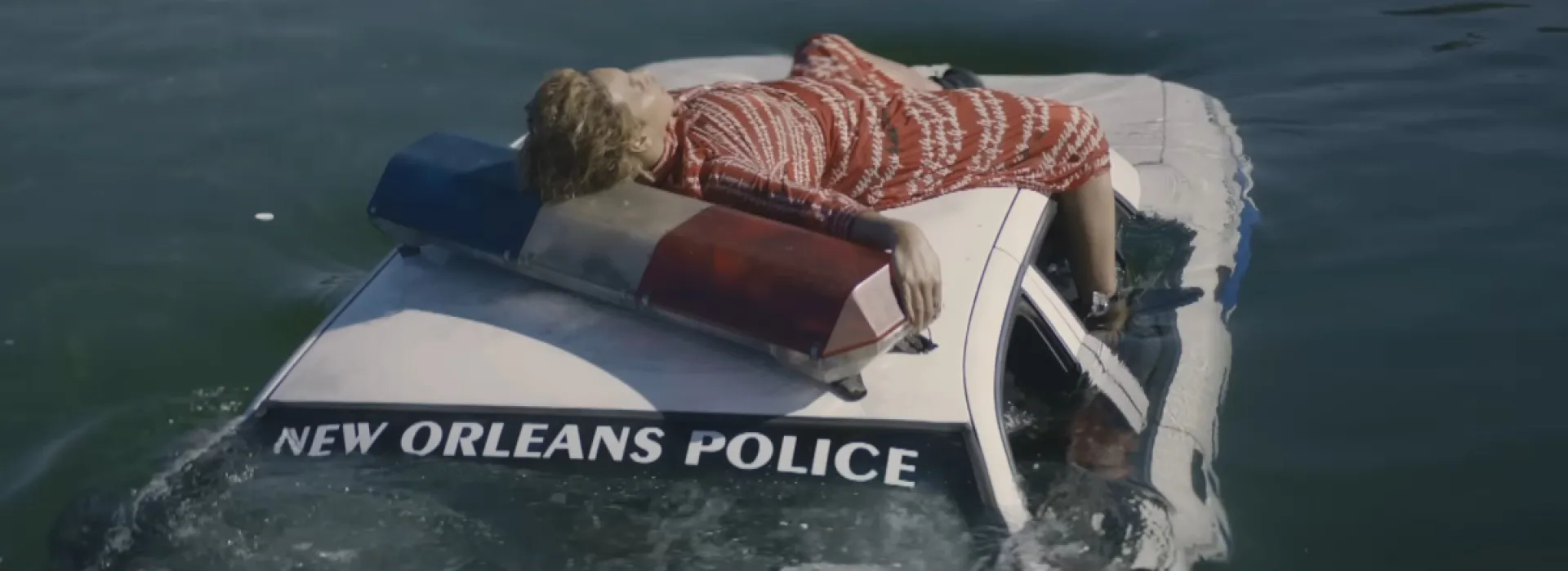 Beyoncé lying on top of a sinking car representing the New Orleans Police Dept in 'Formation.' 