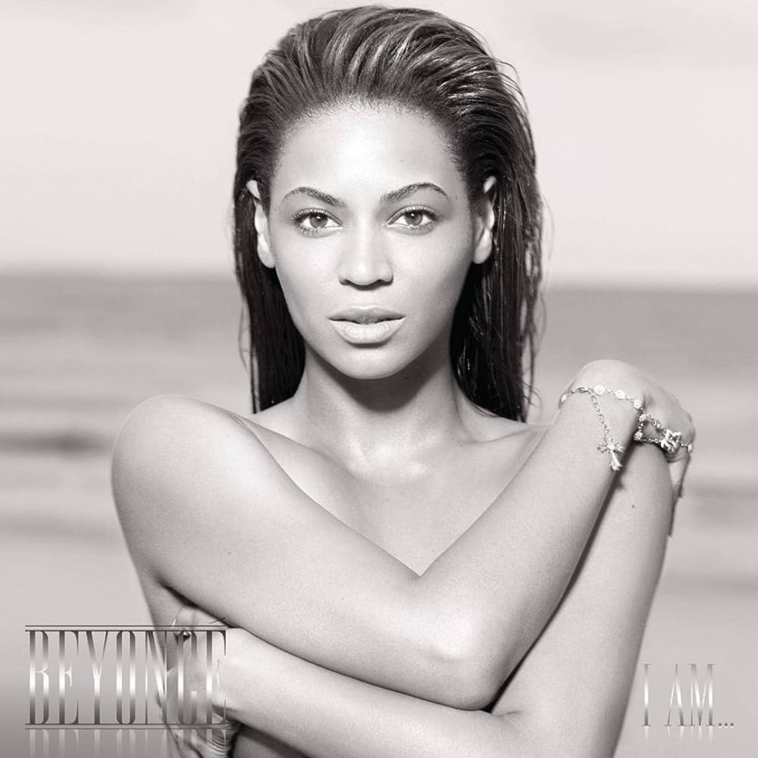 Beyoncé holding herself with her hair slicked back in front of an ocean for 'I Am... Sasha Fierce.' 