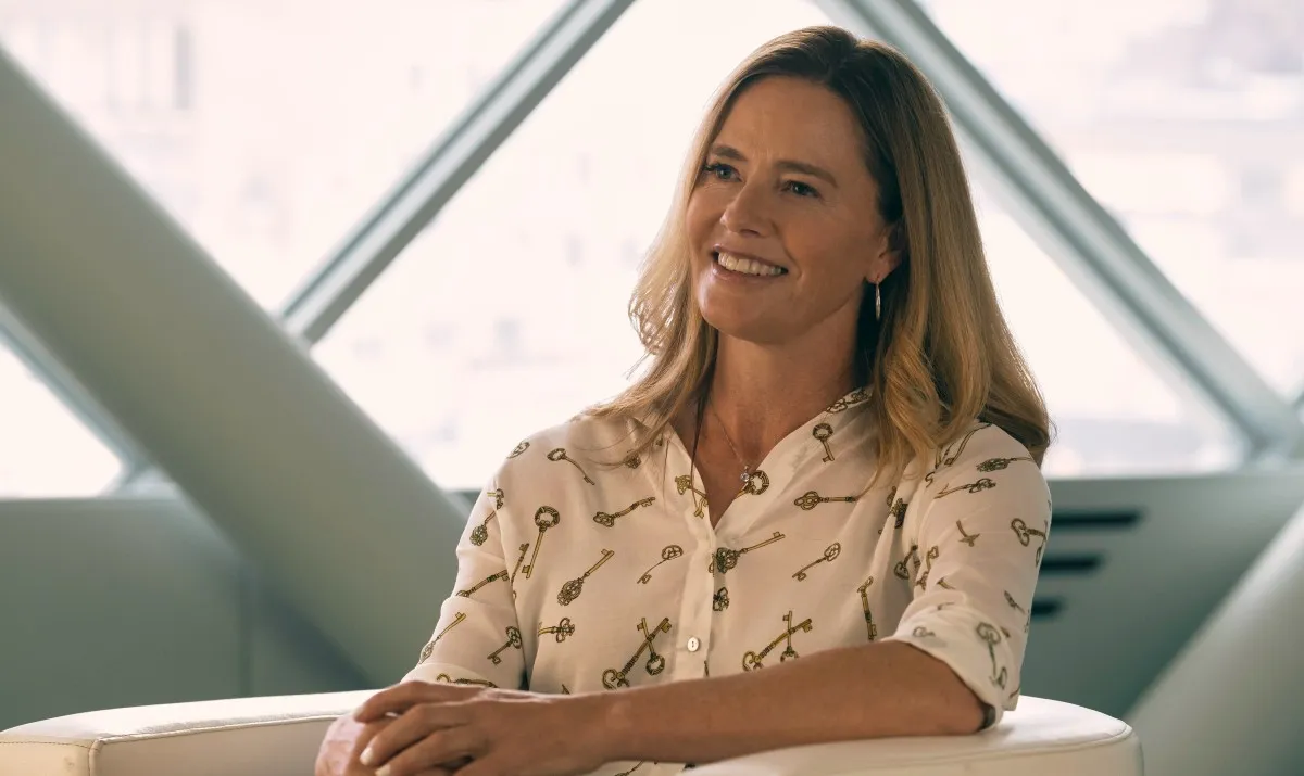 Elizabeth Shue as Madelyn Stillwell. A white woman in business casual smiles in 'Gen V.'