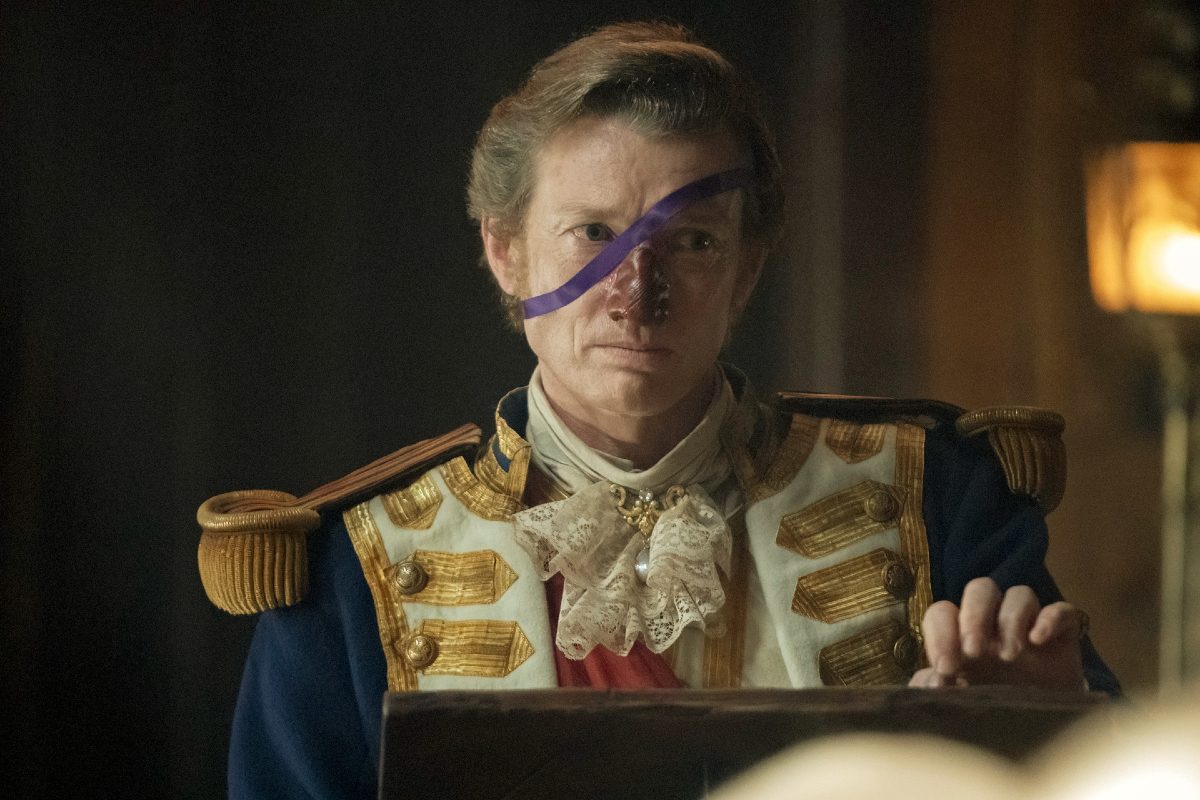 A man with a prosthetic nose wears a British uniform from the 1700s in 'Our Flag Means Death.'