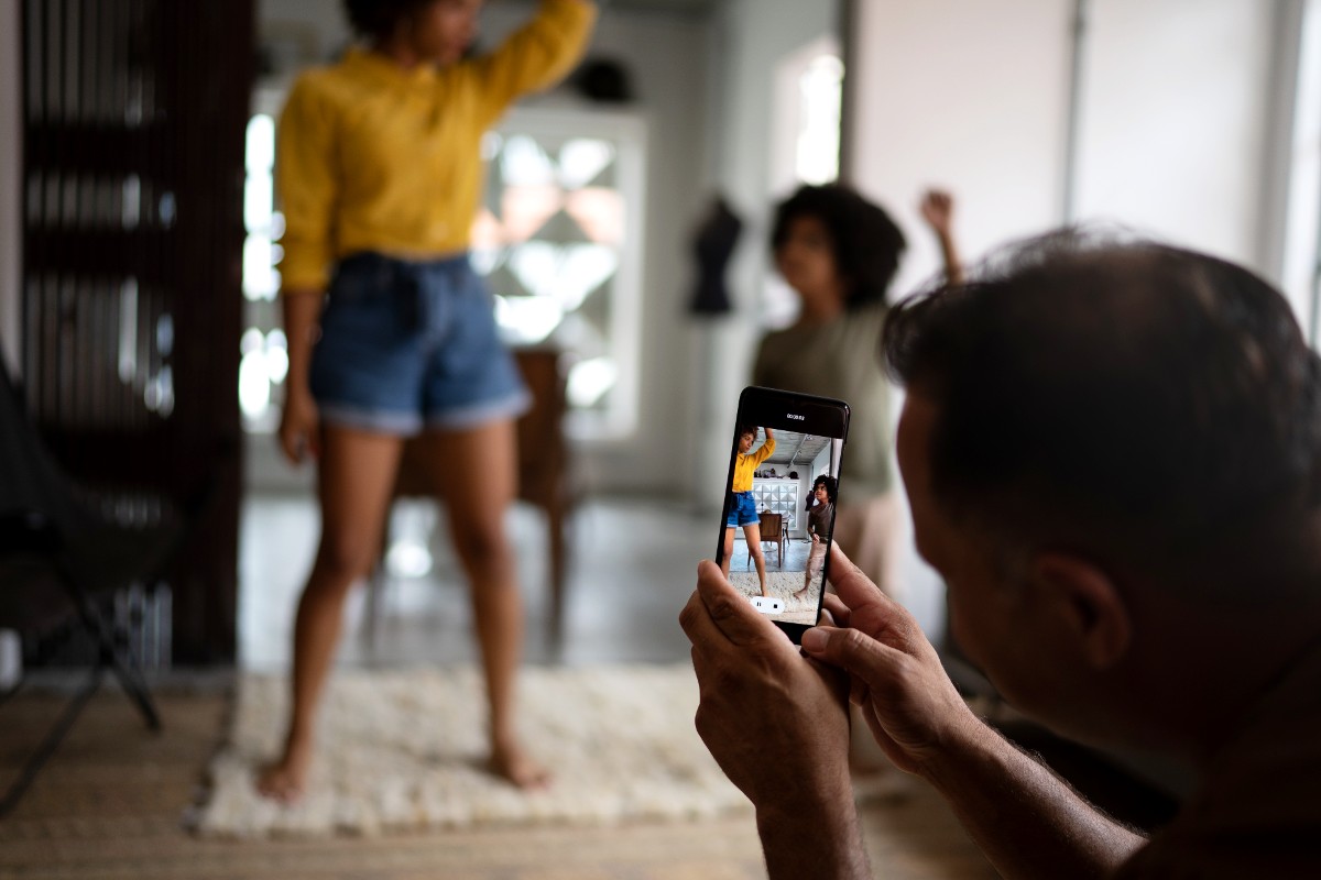 A parent filming their kids