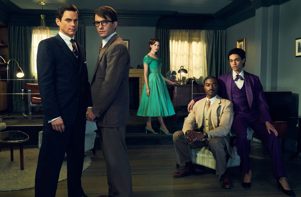 A group of people in 1950s clothing in 'Fellow Travelers.'