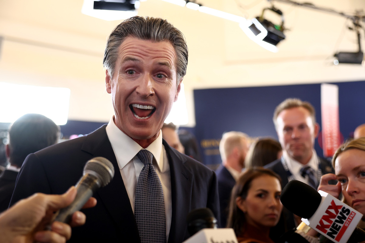 California gov. Gavin Newsom makes a creepy face while answering questions after a Republican primary event in California.