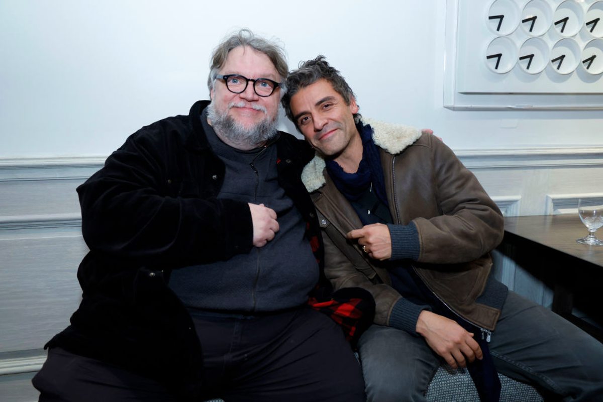 Guillermo del Toro and Oscar Isaac at a press event. 