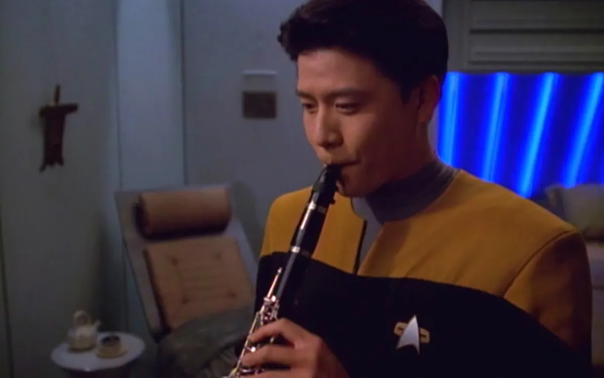 Garrett Wang as Harry Kim; Kim is playing an instrument