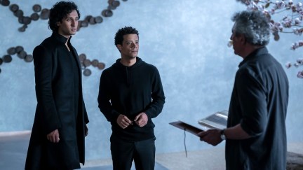 Two vampires, Armand and Louis, stand with a man, Daniel, in 'Interview with the Vampire.'