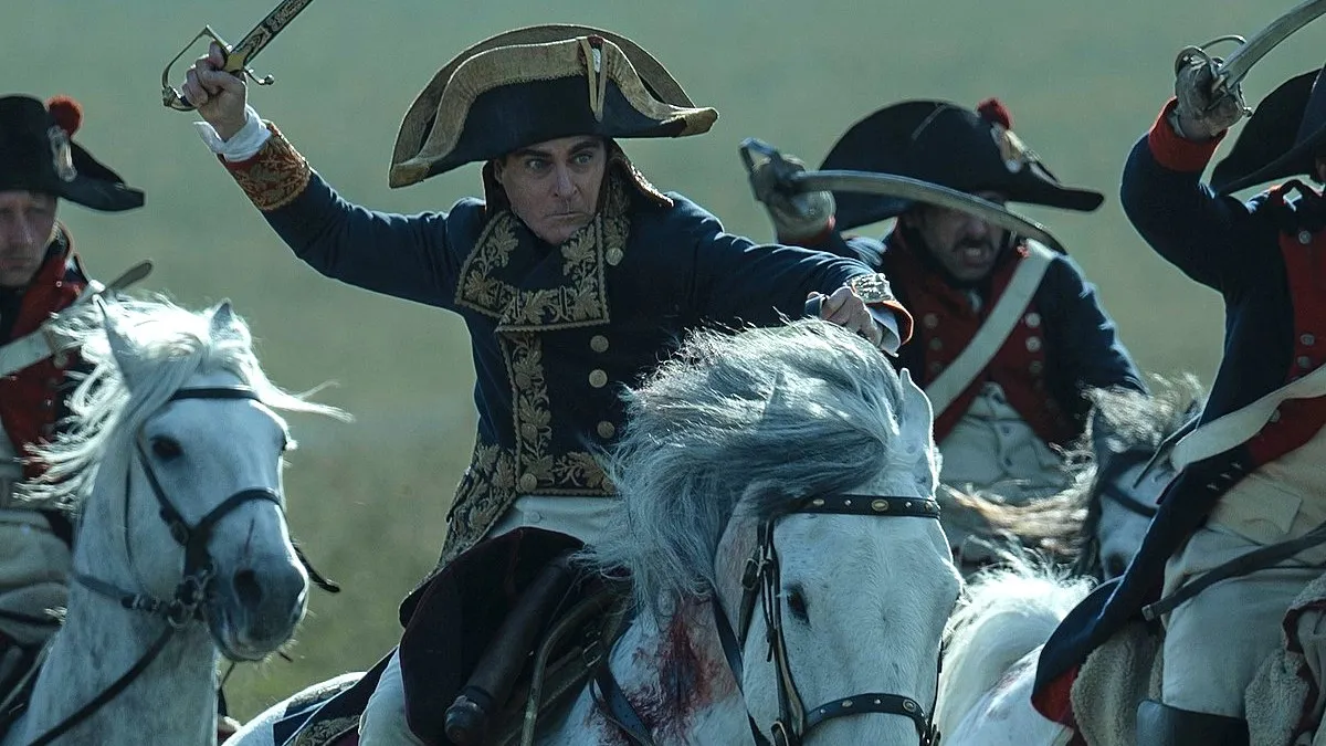 Joaquin Phoenix as Napoleon Bonaparte on a horse in Napoleon