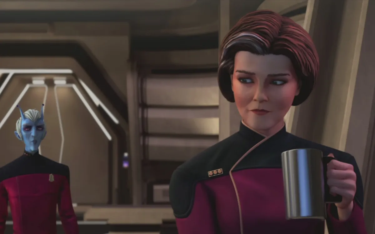 Vice Admiral Kathryn Janeway sips a hot beverage