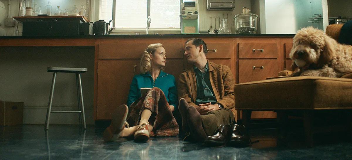 Lewis Pullman and Brie Larson in Lessons in Chemistry from Apple TV+