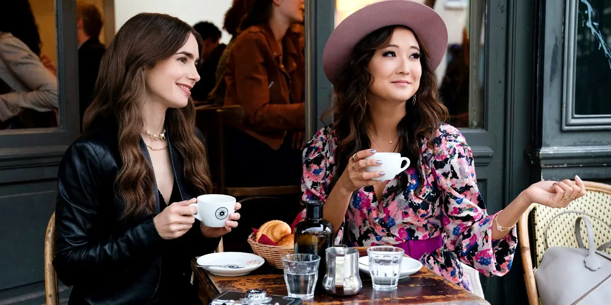 Lily Collins as Emily Cooper and Ashley Park as Mindy Chen in Emily in Paris