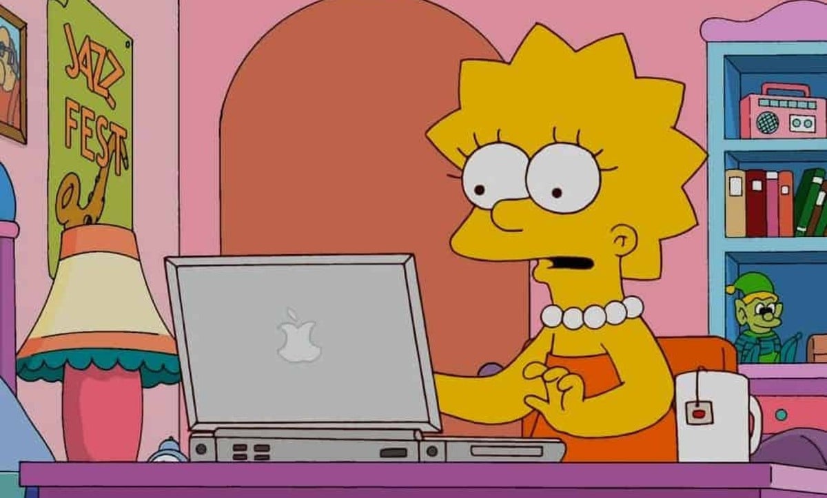 Lisa Simpson sits at her computer with a cup of tea ready to write on 'The Simpsons.'