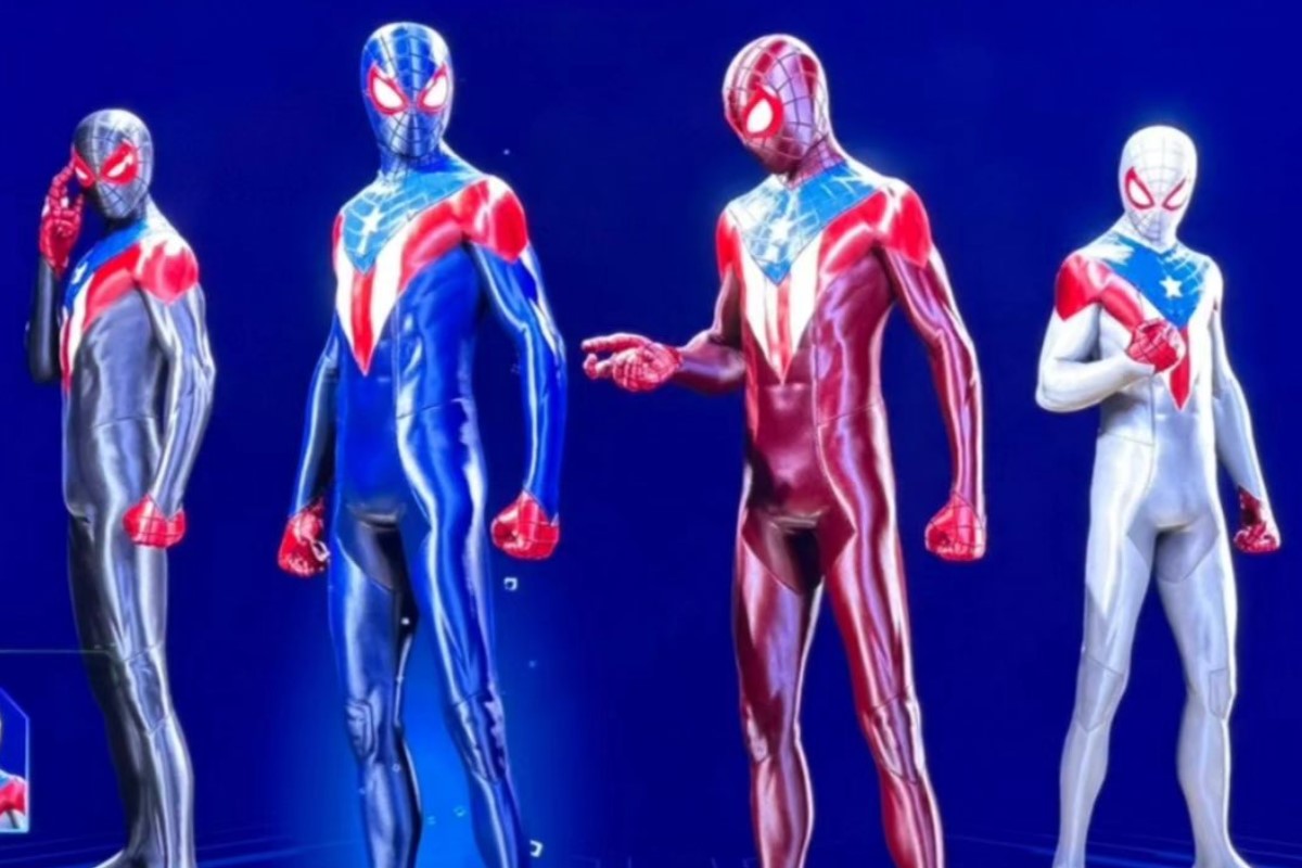 Image of four different Puerto Rican Spider-Man suits to choose from that can be unlocked in the game 'Marvel's Spider-Man 2.' They stand against a blue background and all the suits have a Puerto Rican flag design down the chest. From left to right, the suits are greyish-blue, blue, red, and white. 