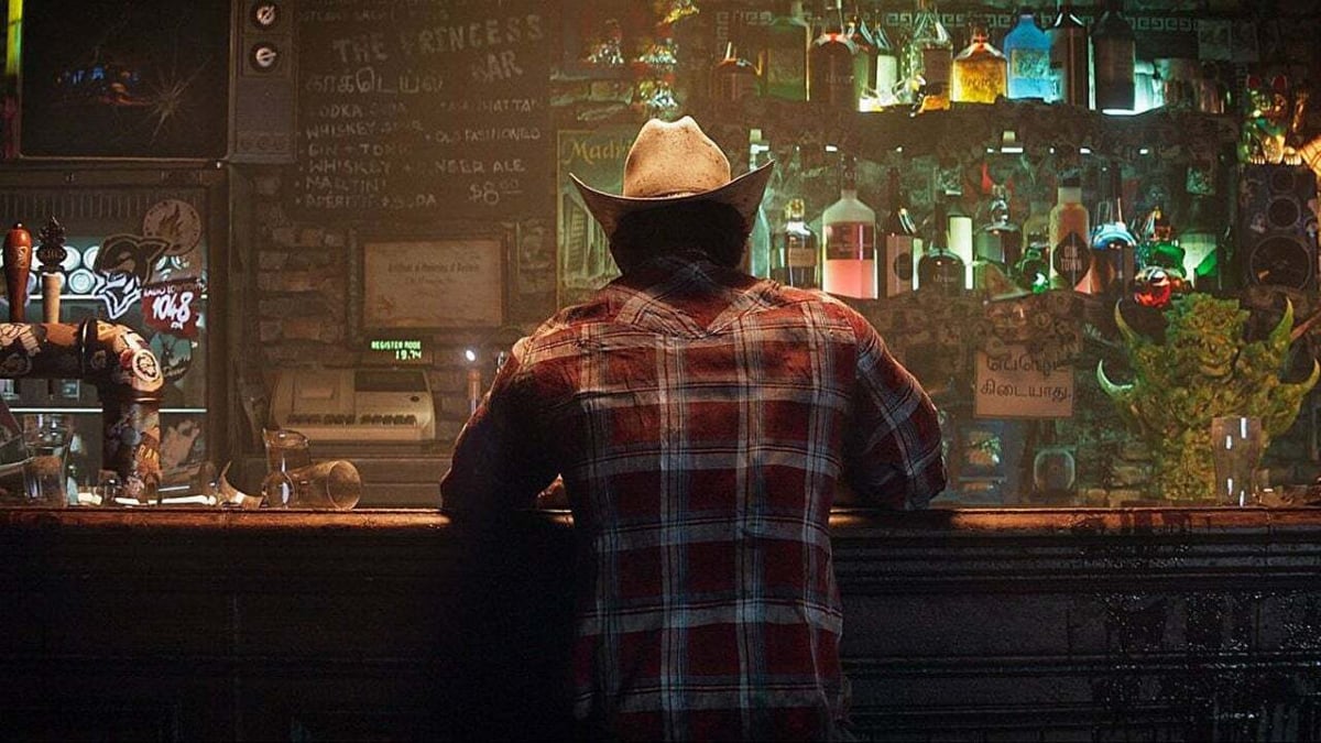 Wolverine sits at a bar with his back turned toward the viewer in 'Marvel's Wolverine'
