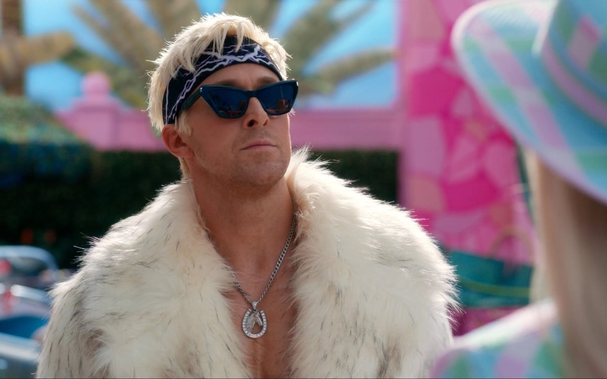 Ryan Gosling as Ken is a blonde white man in sunglasses and a white furry coat in 'Barbie.'