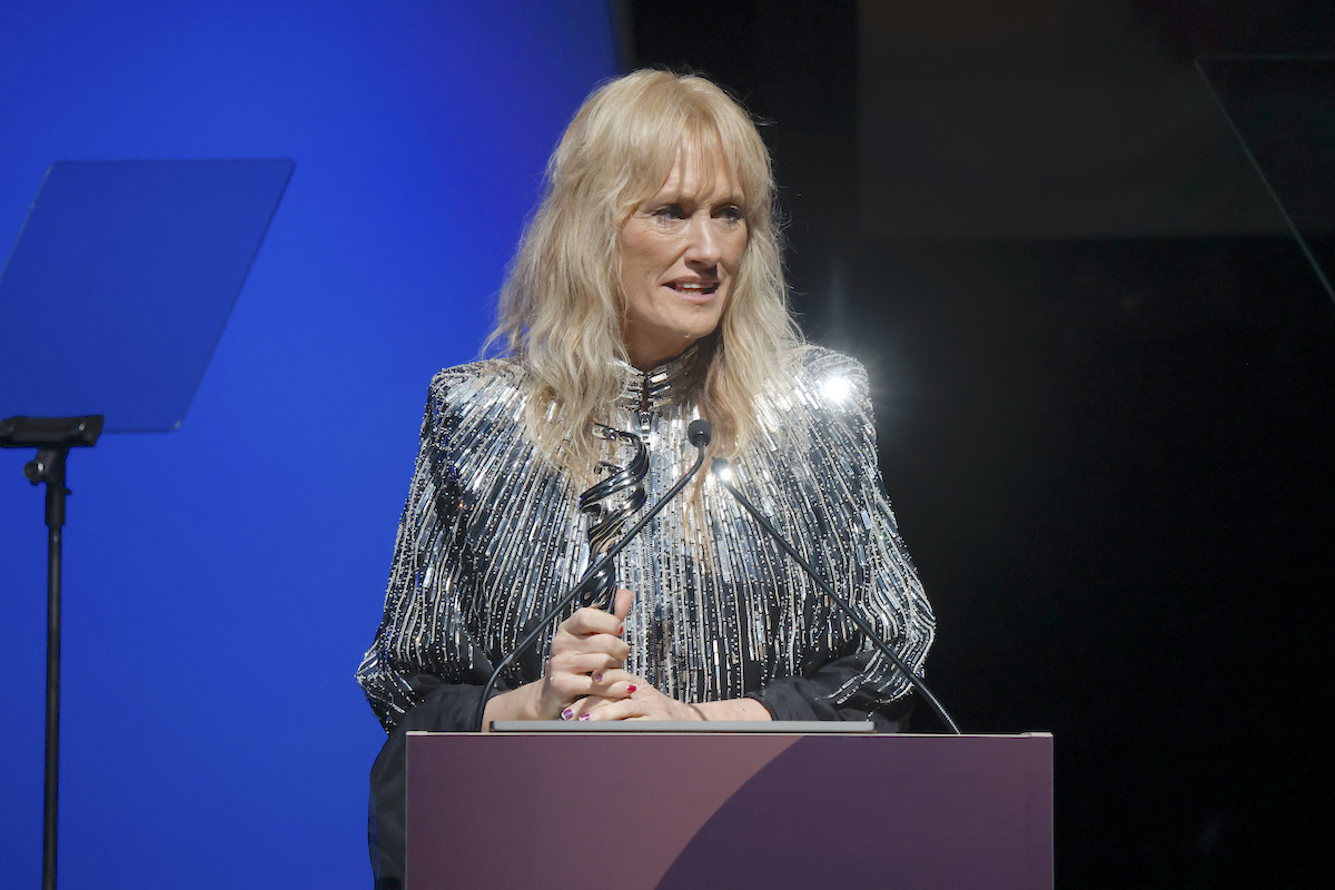 Shawna Trpcic is seen onstage accepting an award.