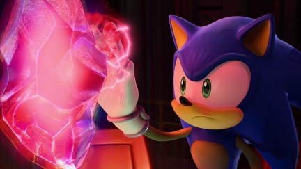 Sonic the Hedgehog touches a glowing gem in 'Sonic Prime.'