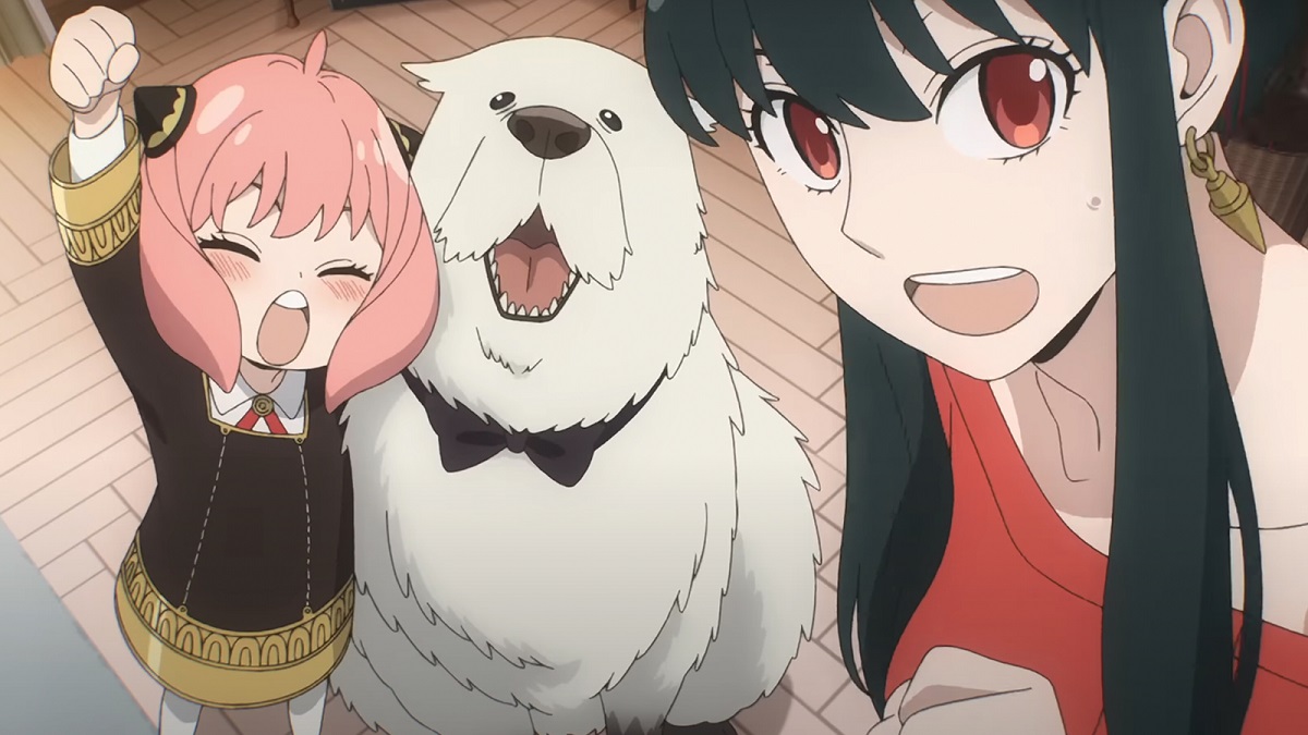 Anya, Bond, and Yor in a scene from 'Spy Family.' Anya has one arm around Bond and is raising a fist in the air cheering. bond is wearing a bow tie and looking happy, and Yor is in the foreground, also looking happy.