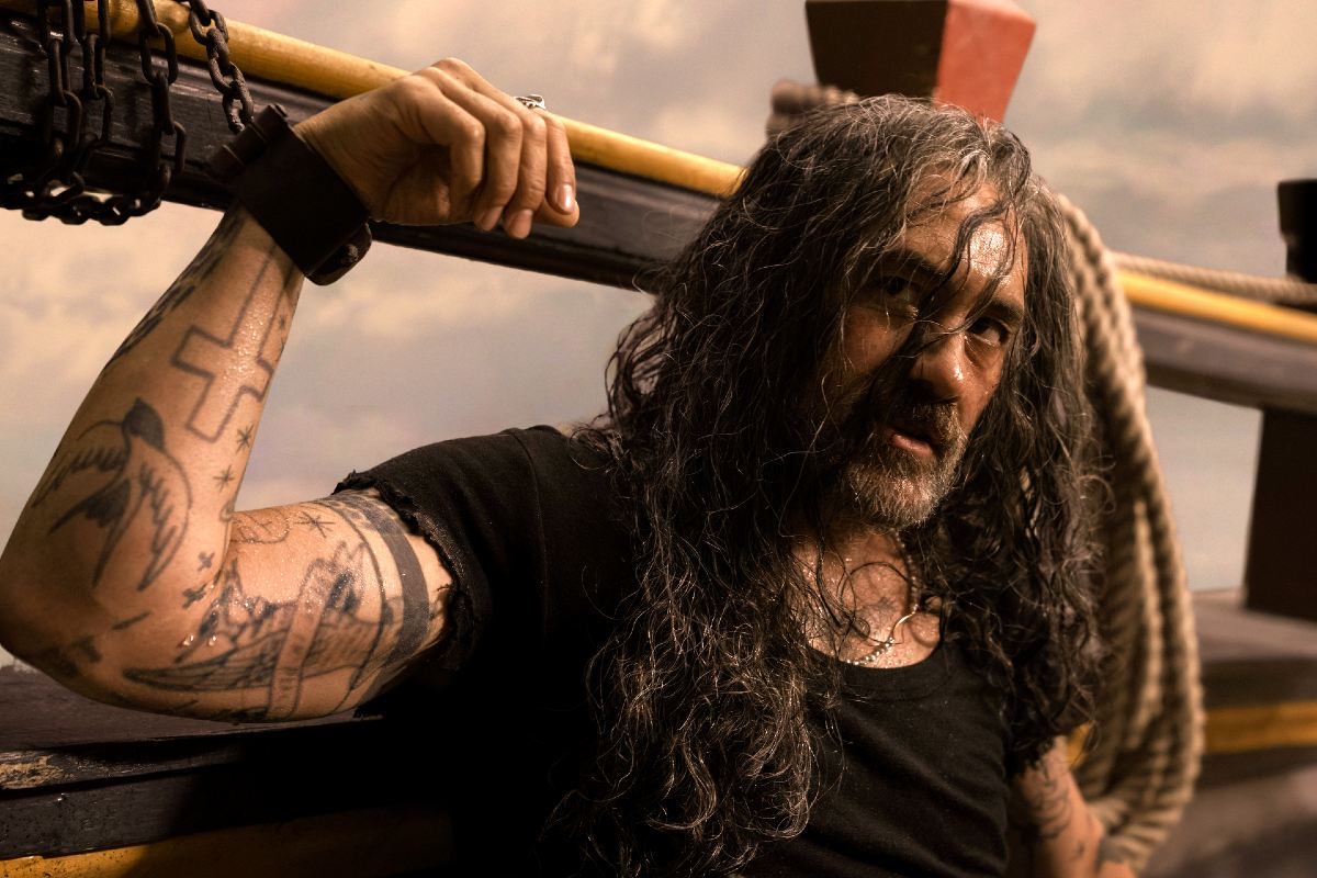 A pirate tied to the ship casually flexing in 'Our Flag Means Death.'