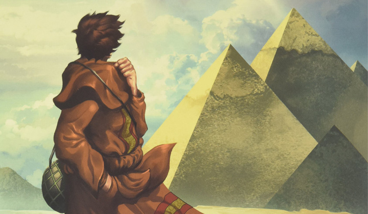 Cover art for the Hardcover version of Paulo Coelho's The Alchemist: A Graphic Novel, featuring a figure facing a collection of pyramids.