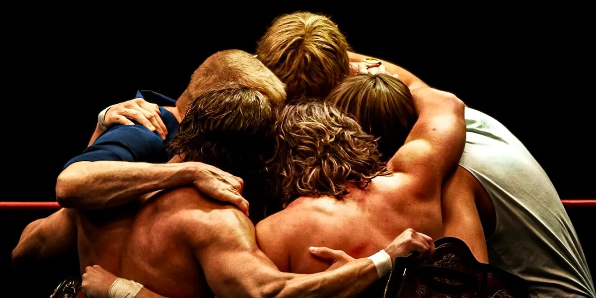 The Von Erich family in a huddle in The Iron Claw