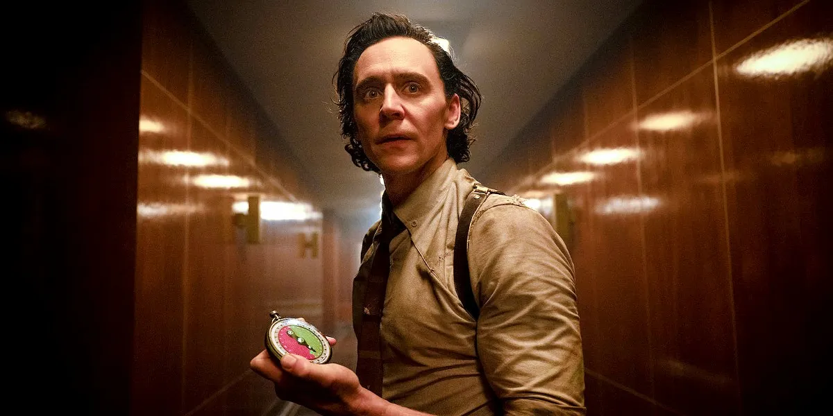 Tom Hiddleston as Loki in Loki, holding a timer and looking worried