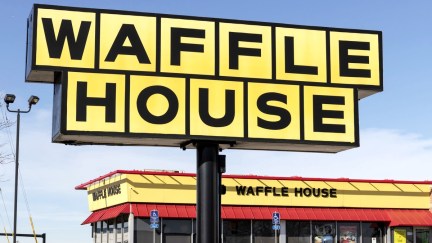A sign outside of a Waffle House restaurant