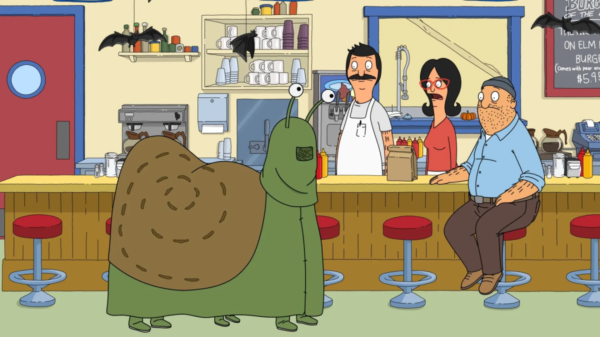 Still from Bob's Burgers episode Heartbreak Hotel-oween; Bob and Linda stand behind the counter in the restaurant, Teddy sits on a stool in front, and the kids stand in their three person snail costume.