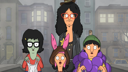 Still from Bob's Burgers episode The Wolf of Warf Street; Linda and the kids stand on a misty street, dressed as a zombie, John Wick, a bunch of grapes, and a Cher-if. They all look scared.