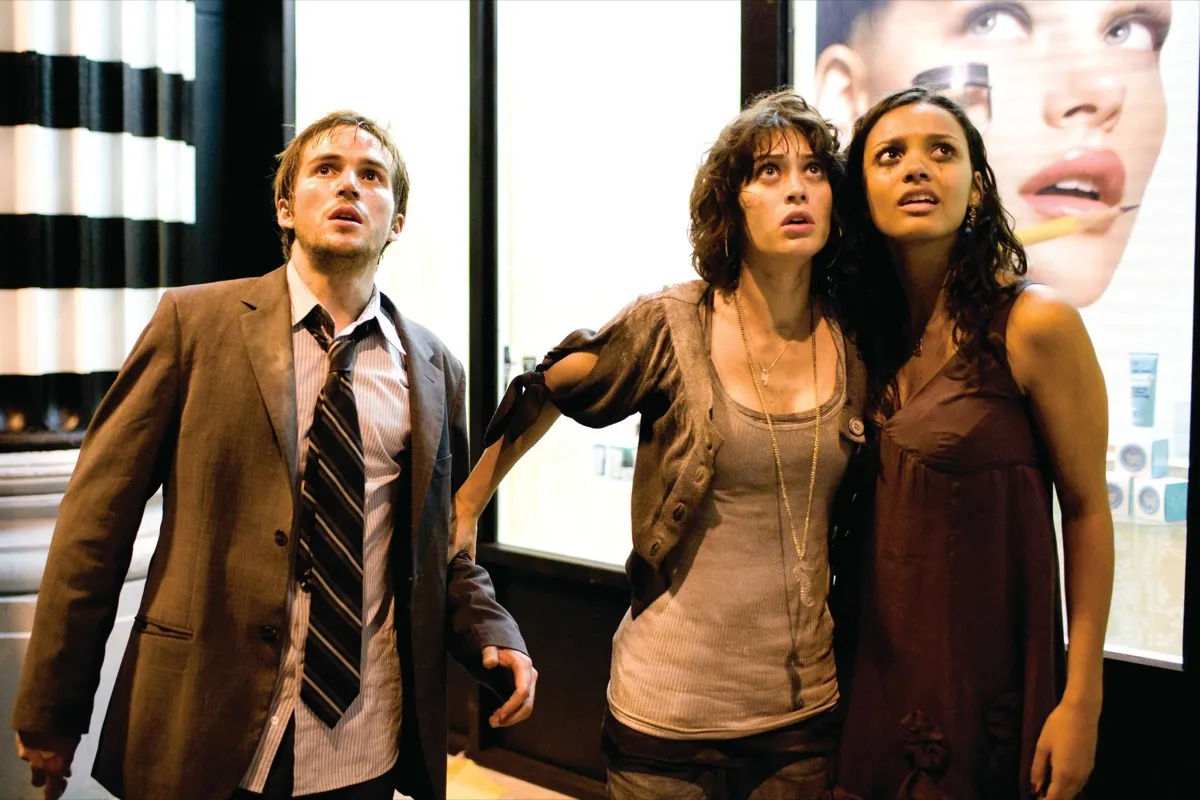 Three dirty twenty somethings stare up in horror at a giant offscreen monster in "Cloverfield"