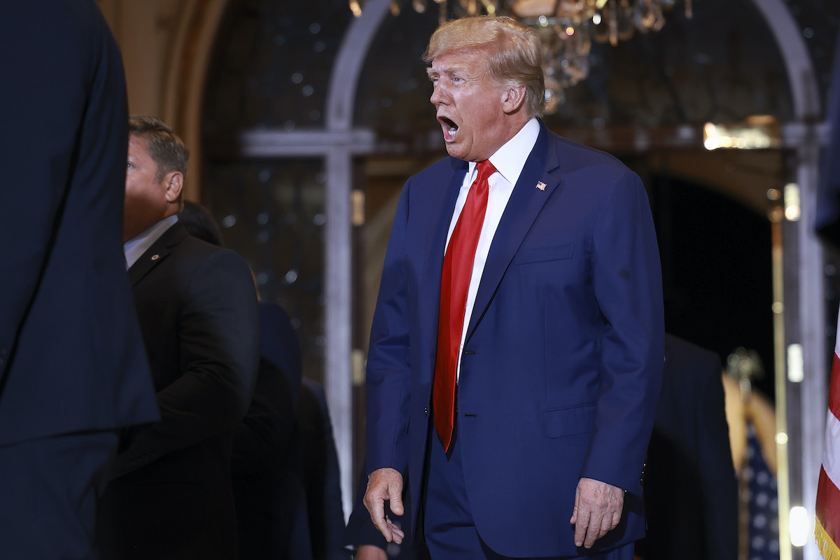 Donald Trump stands awkwardly and yells.