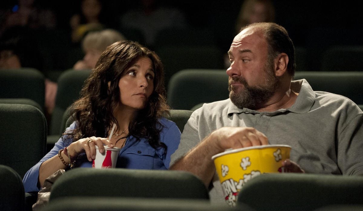 Julia Louis-Dreyfus as Eva and James Gandolfini as Albert in 'Enough Said' eating popcorn at the movies.