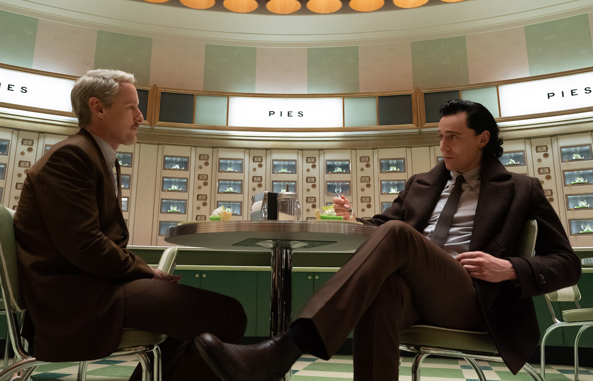 Mobius and Loki sit in the TVA automat, eating pie.