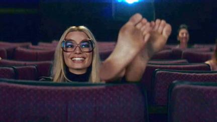 Margot Robbie and her feet in a movie theater in Once Upon a Time...In Hollywood