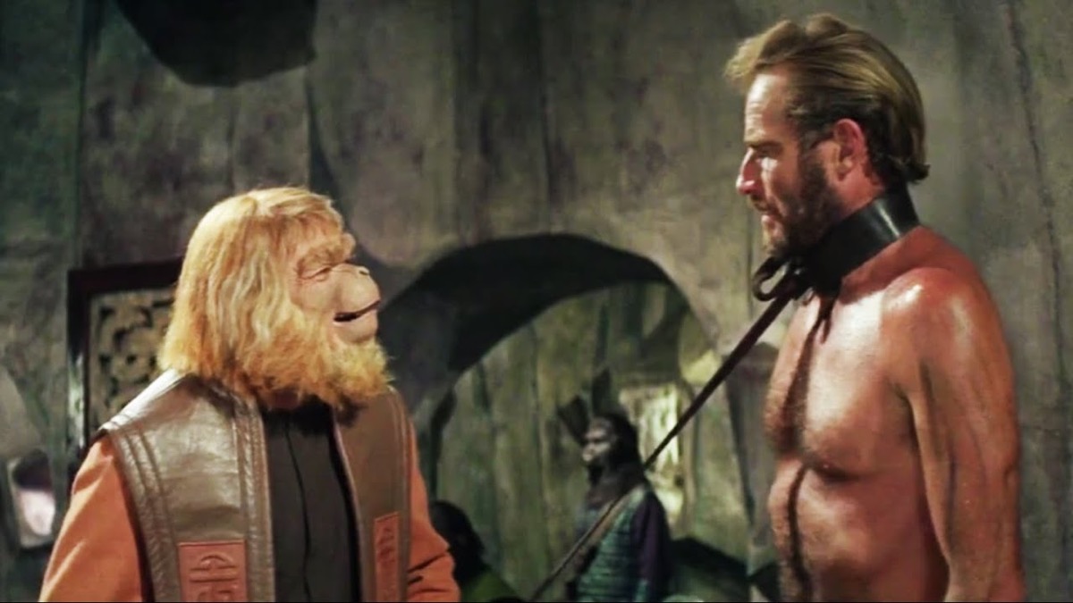 An ape talks to a man in shackles in "Planet of the Apes"