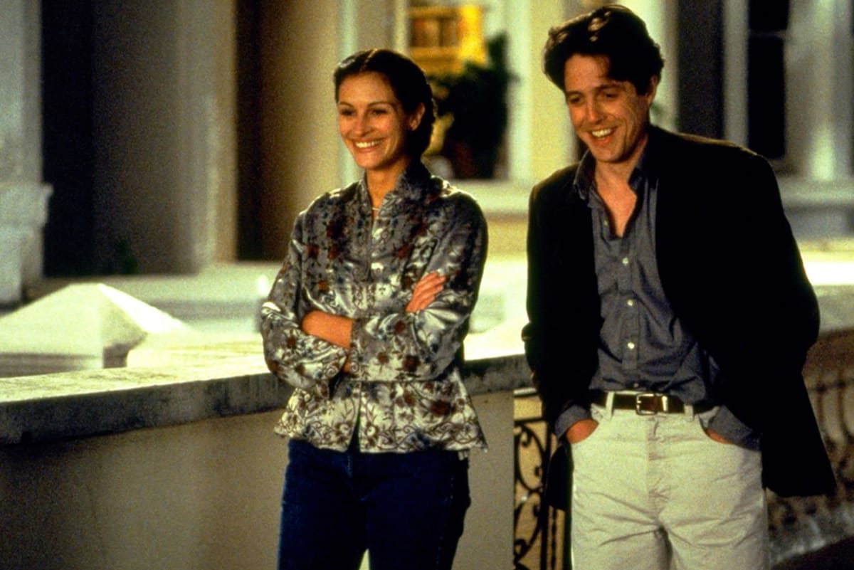 Julia Roberts as Anna Scott and Hugh Grant as William Thacker in 'Notting Hill' walking down the street.