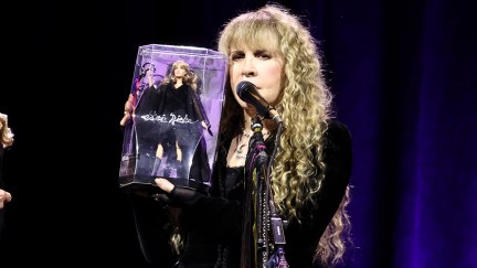 Stevie Nicks unveils the Barbie doll based on her likeness during a performance in New York City