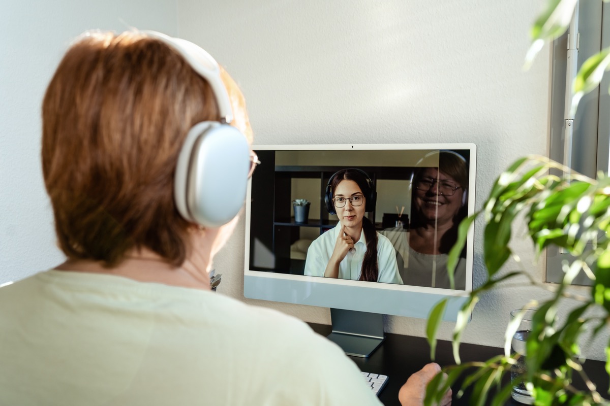 A woman receives telemedicine therapy.