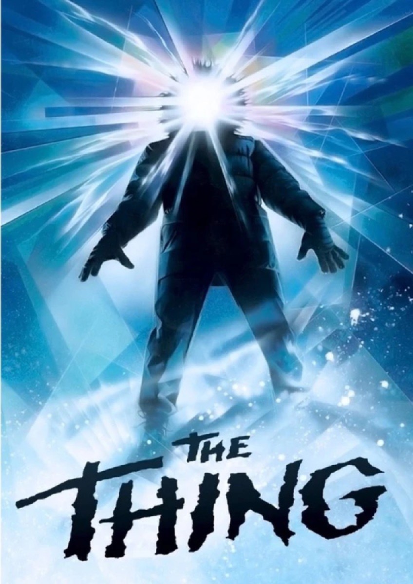A human form stands in an ice abyss with light coming from its head in "The Thing"